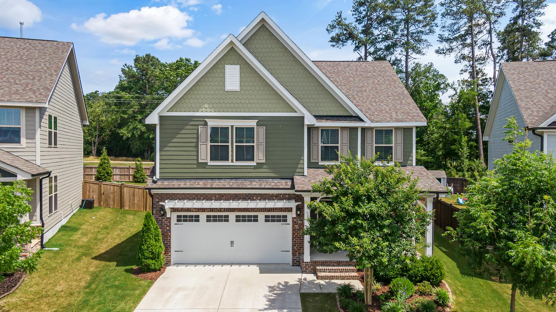 Garage conversion project exterior showing finished living space
